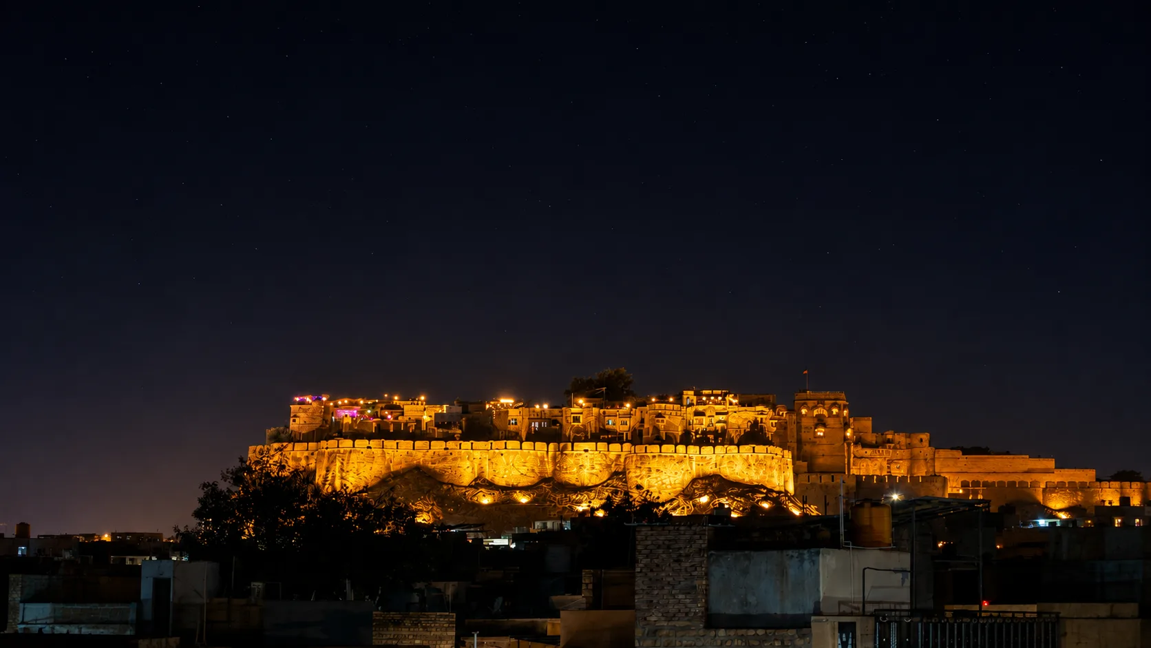 Jaisalmer Fort's golden ramparts illuminated at night
