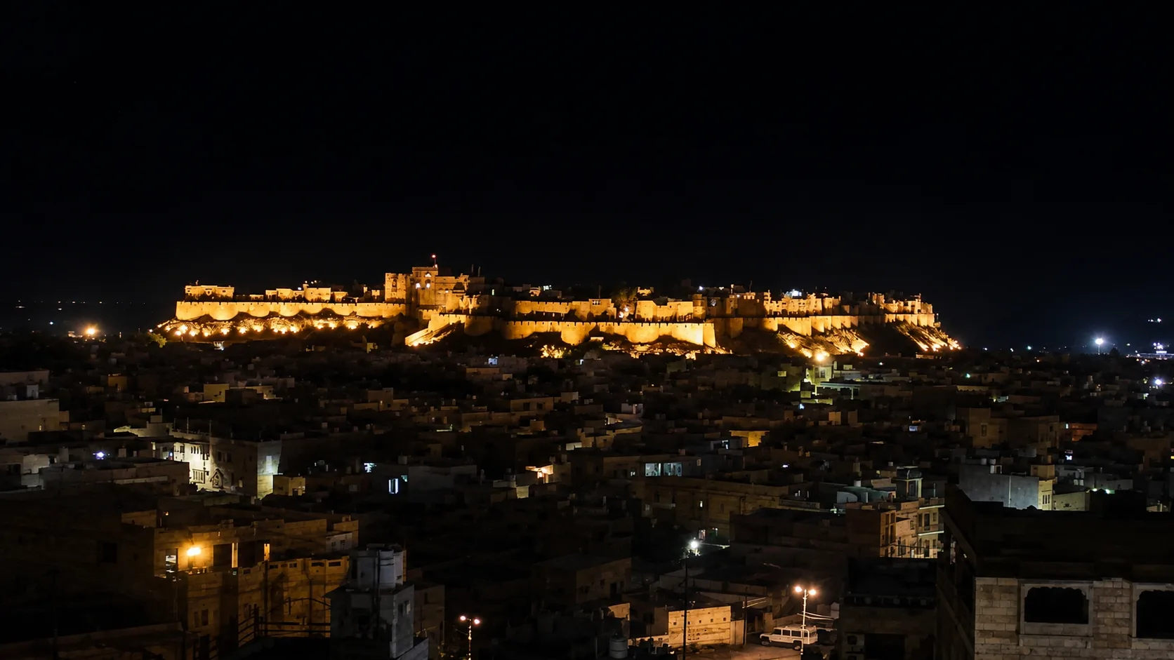 Jaisalmer Fort illuminated above the old city at night